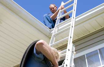 two of our North Highlands roofers are getting ready for work